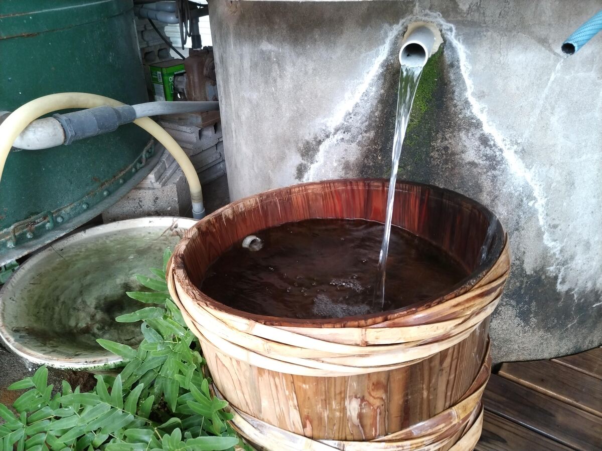 water is poured into a barrel