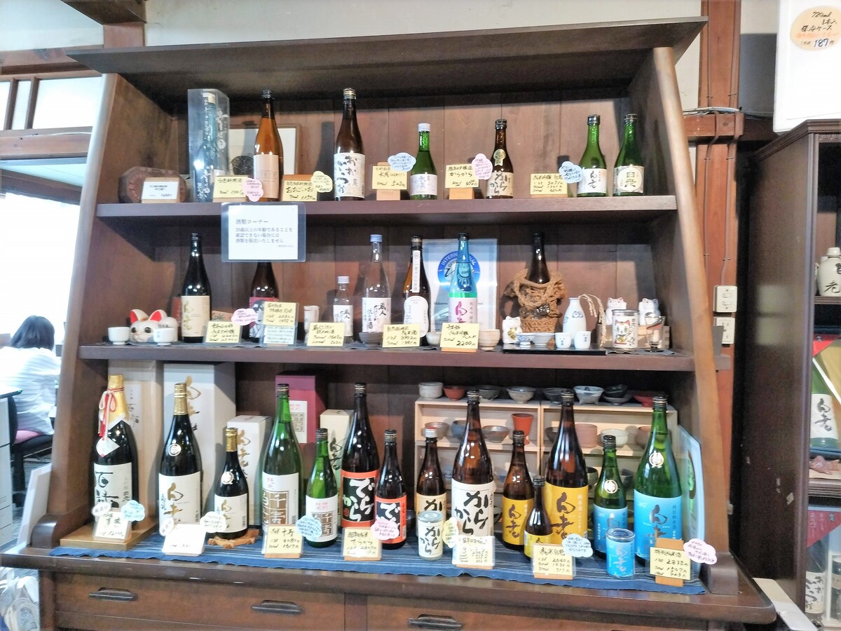 Shelves lined with Japanese sake