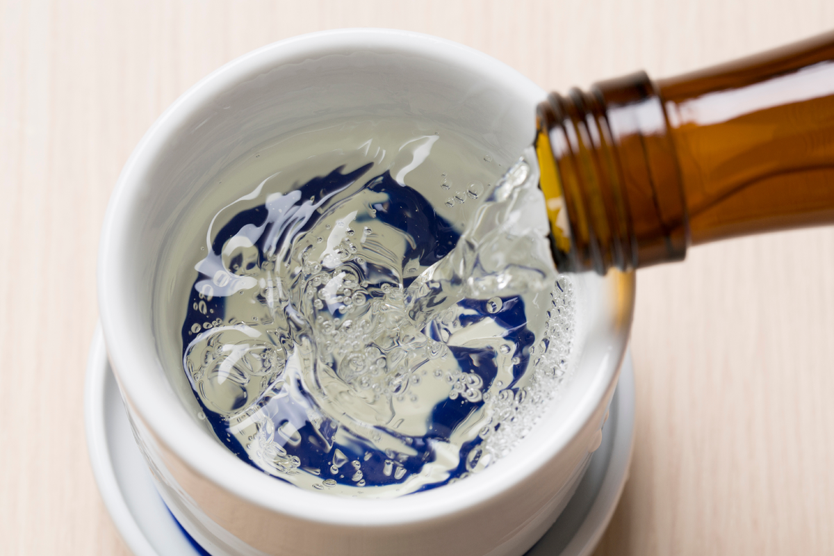 pouring sake into a glass